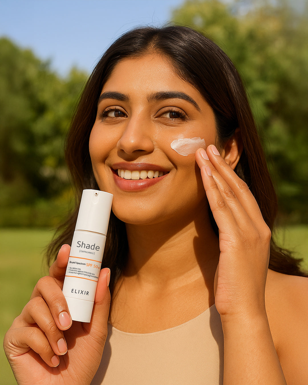 woman applying Elixir sunscreen SPF 50 under sunlight